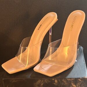Stilettos with a gold heel and see-through at the toes